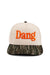 Pearl of the West hat in cream and camo with the word Dang in bright orange on front front view