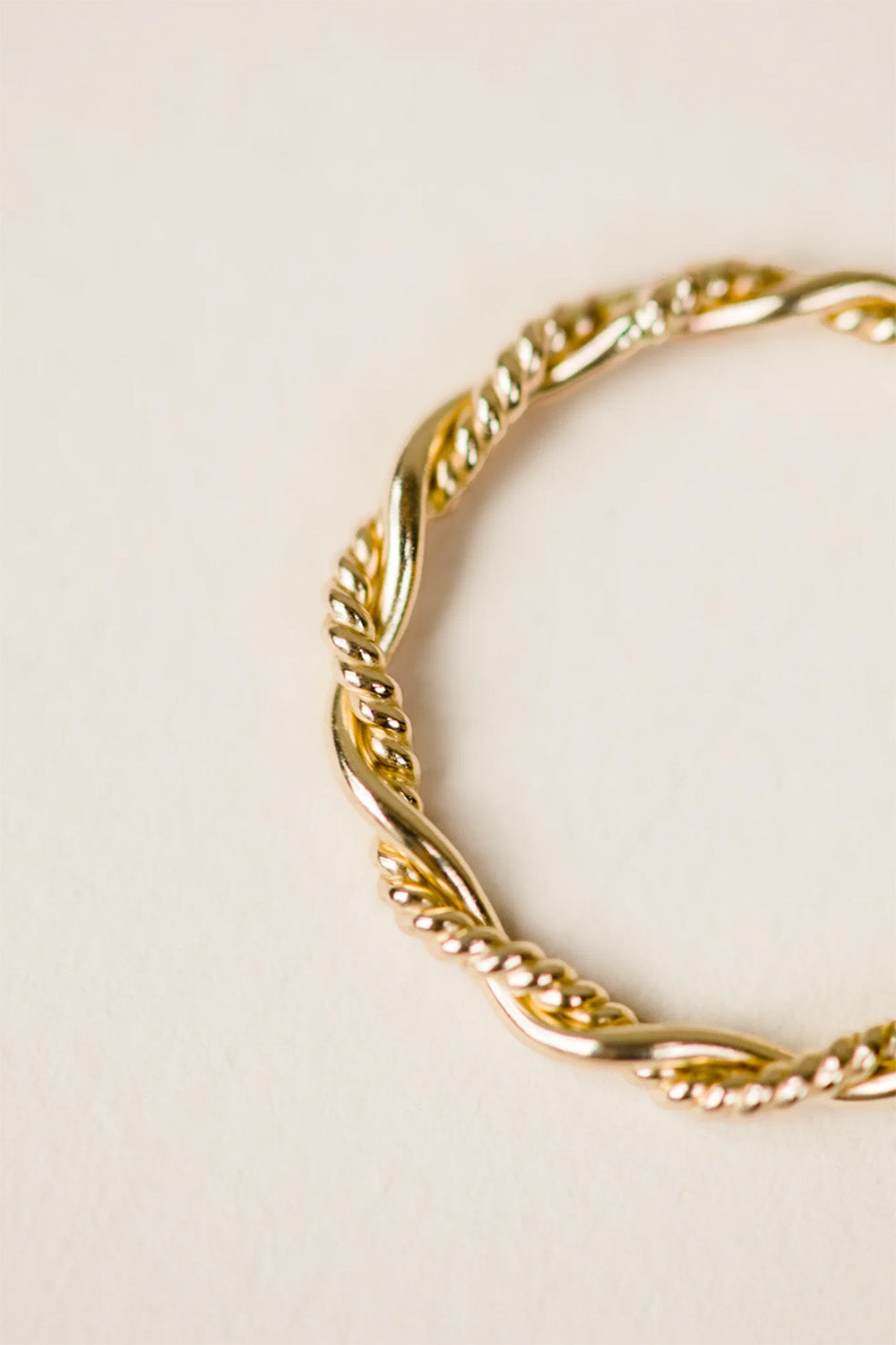 able braided twist ring gold detail