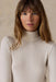 Faherty Featherweight Freestyle Turtleneck in Egret — Neckline detail view