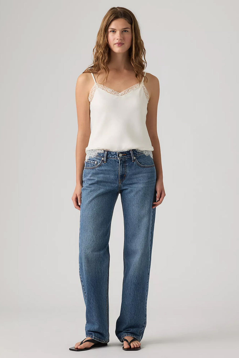 Levi's Low Straight in Real Recognize Real — Front view, hands in pockets