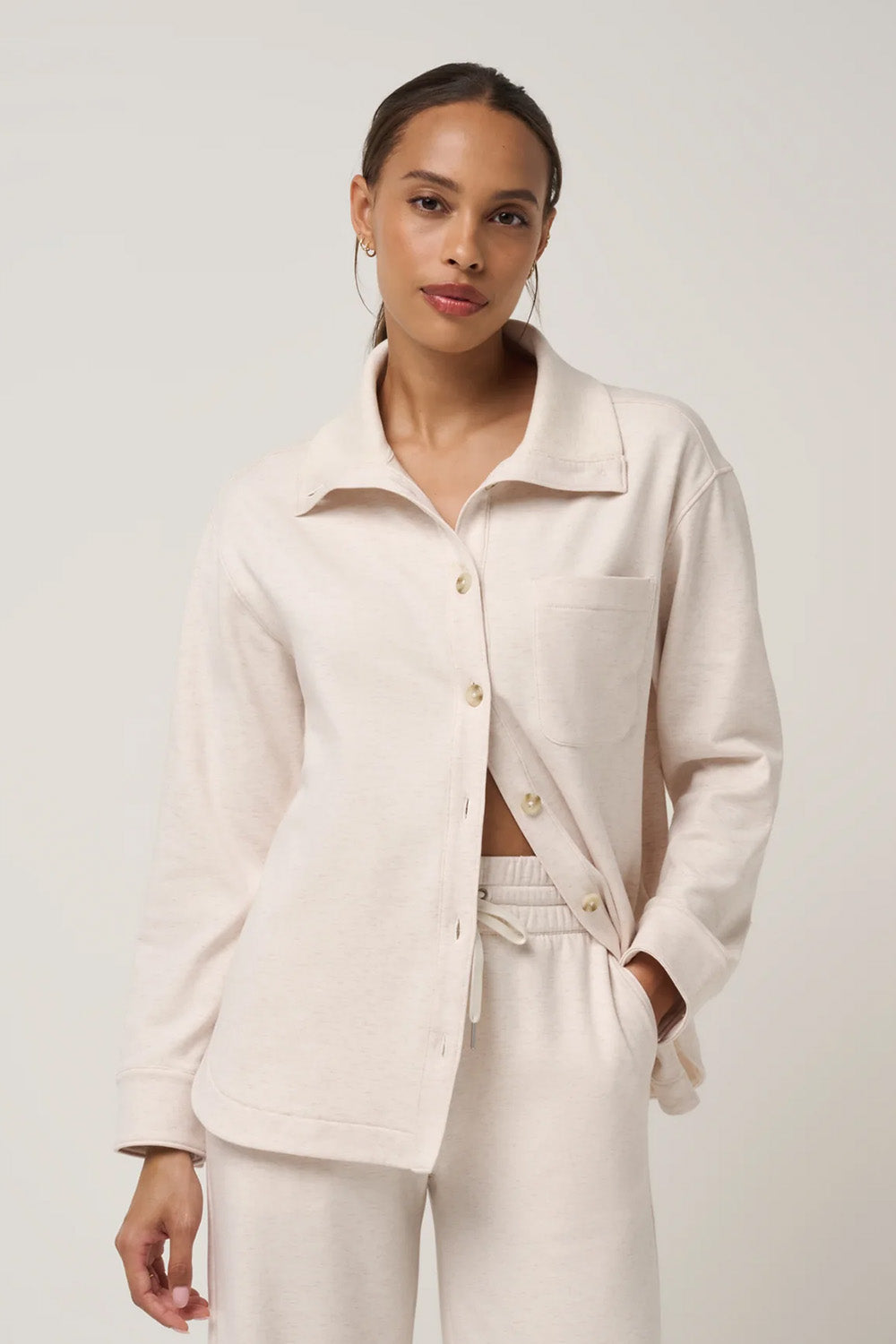 Travis Mathew Cloud Fleece Button Down in Heather Brazillian Sand — Front view