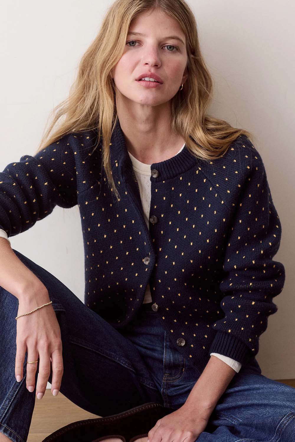 Marine Layer Iris Crewneck Cardigan in Navy & Gold — Front view, seated