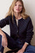 Marine Layer Iris Crewneck Cardigan in Navy & Gold — Front view, seated