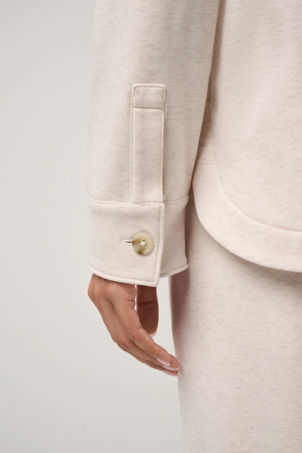 Travis Mathew Cloud Fleece Button Down in Heather Brazillian Sand — Cuff detail view