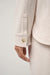 Travis Mathew Cloud Fleece Button Down in Heather Brazillian Sand — Cuff detail view