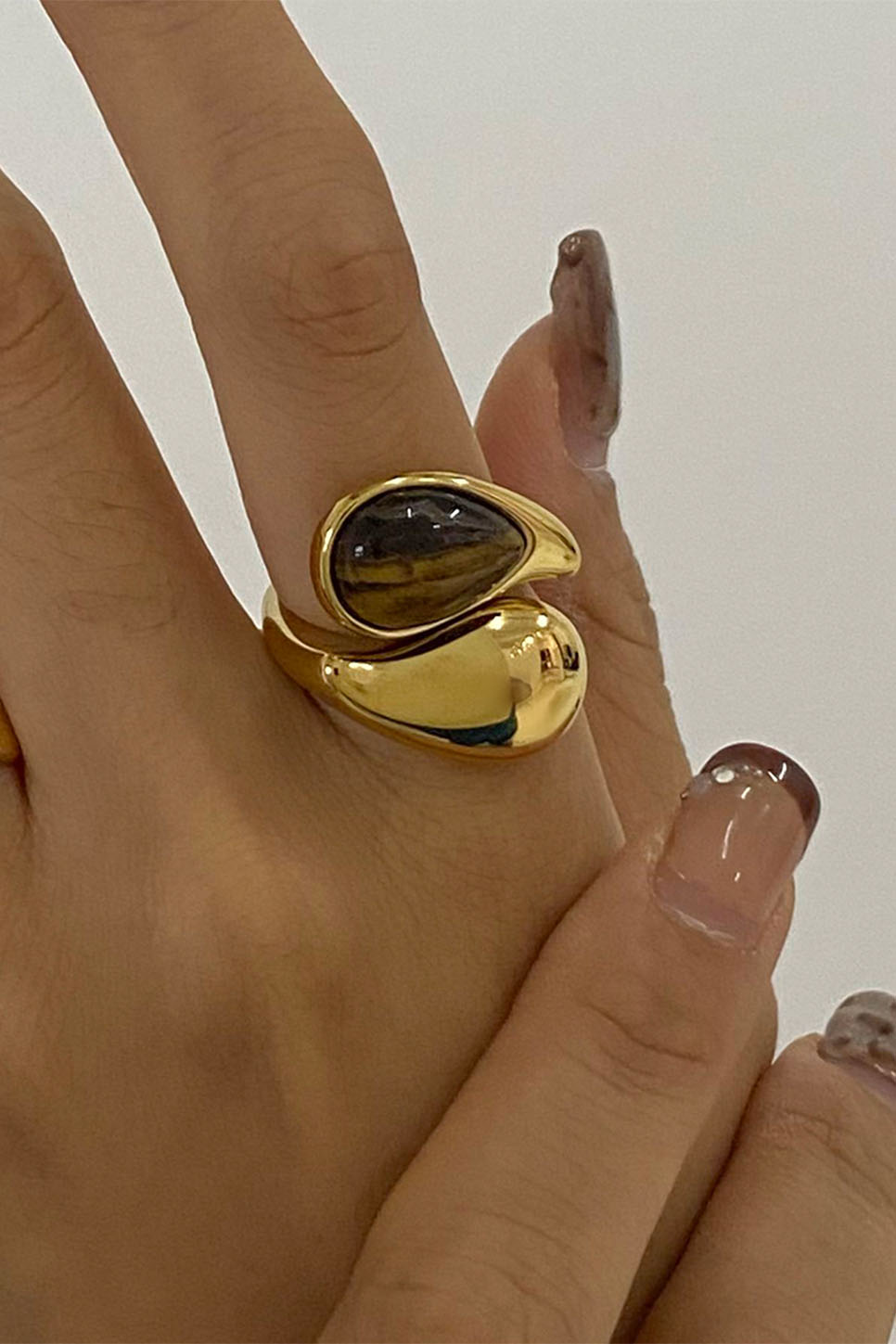 Pearl of the West Stone Crossed Ring in Brown — Worn view