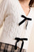 Sadie & Sage Celeste Bows Cardigan in Cream — Bows detail view