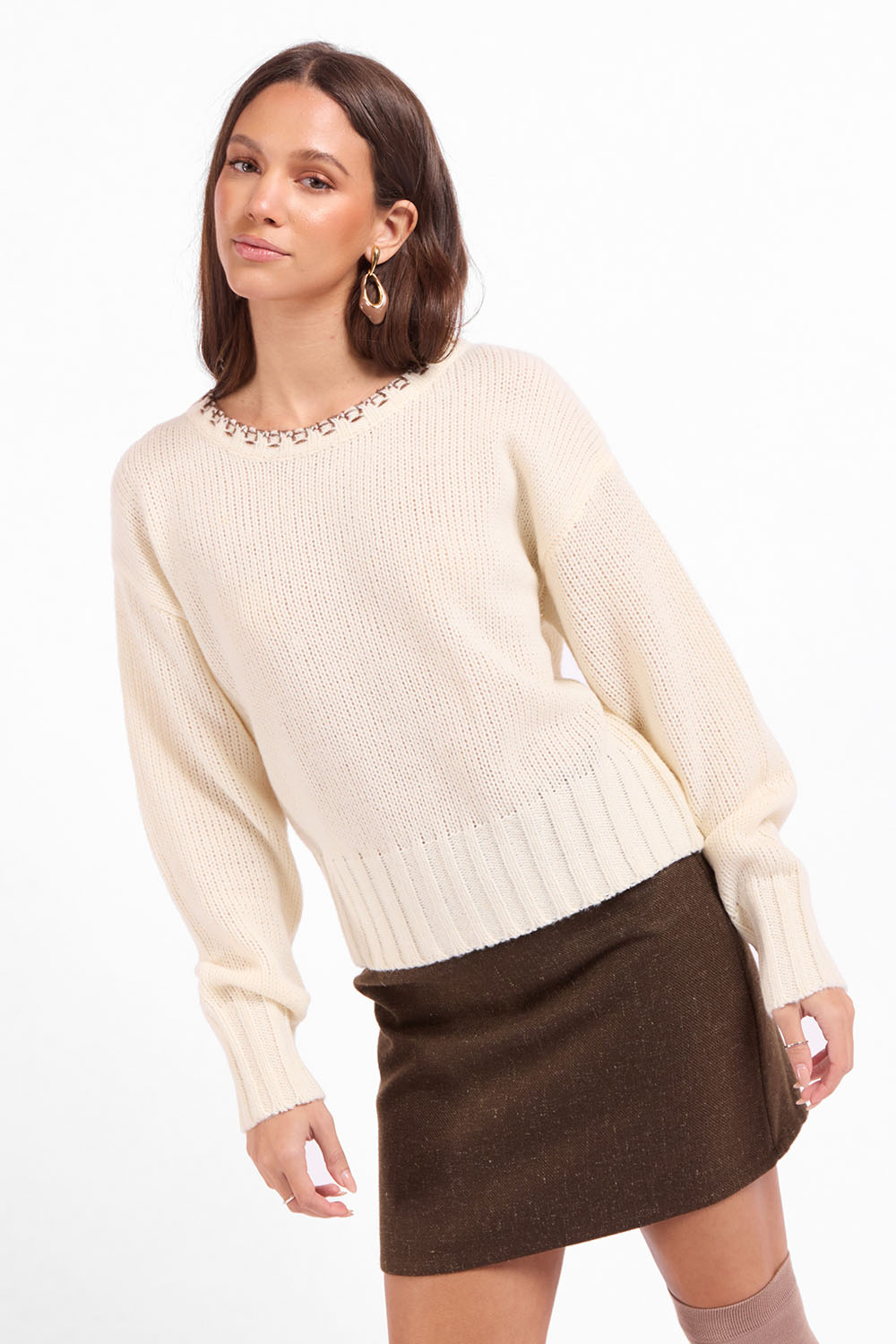 Sage the Label Bookshop Sweater in Cream Oak — Quarter view, hand at hip