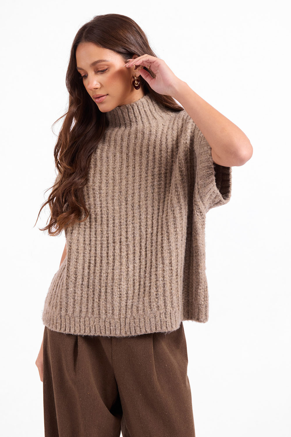 Sage the Label Granger Sweater Vest in Taupe — Quarter view, hand at ear