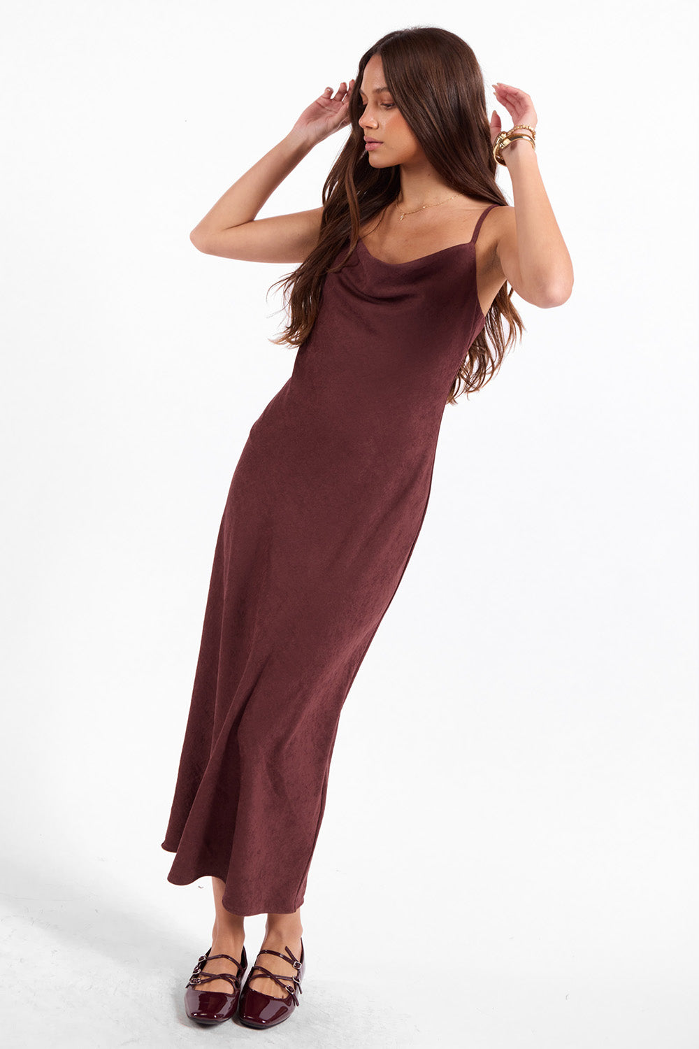 Sage the Label Rhea Slip Dress in Eggplant — Quarter view, hands in hair