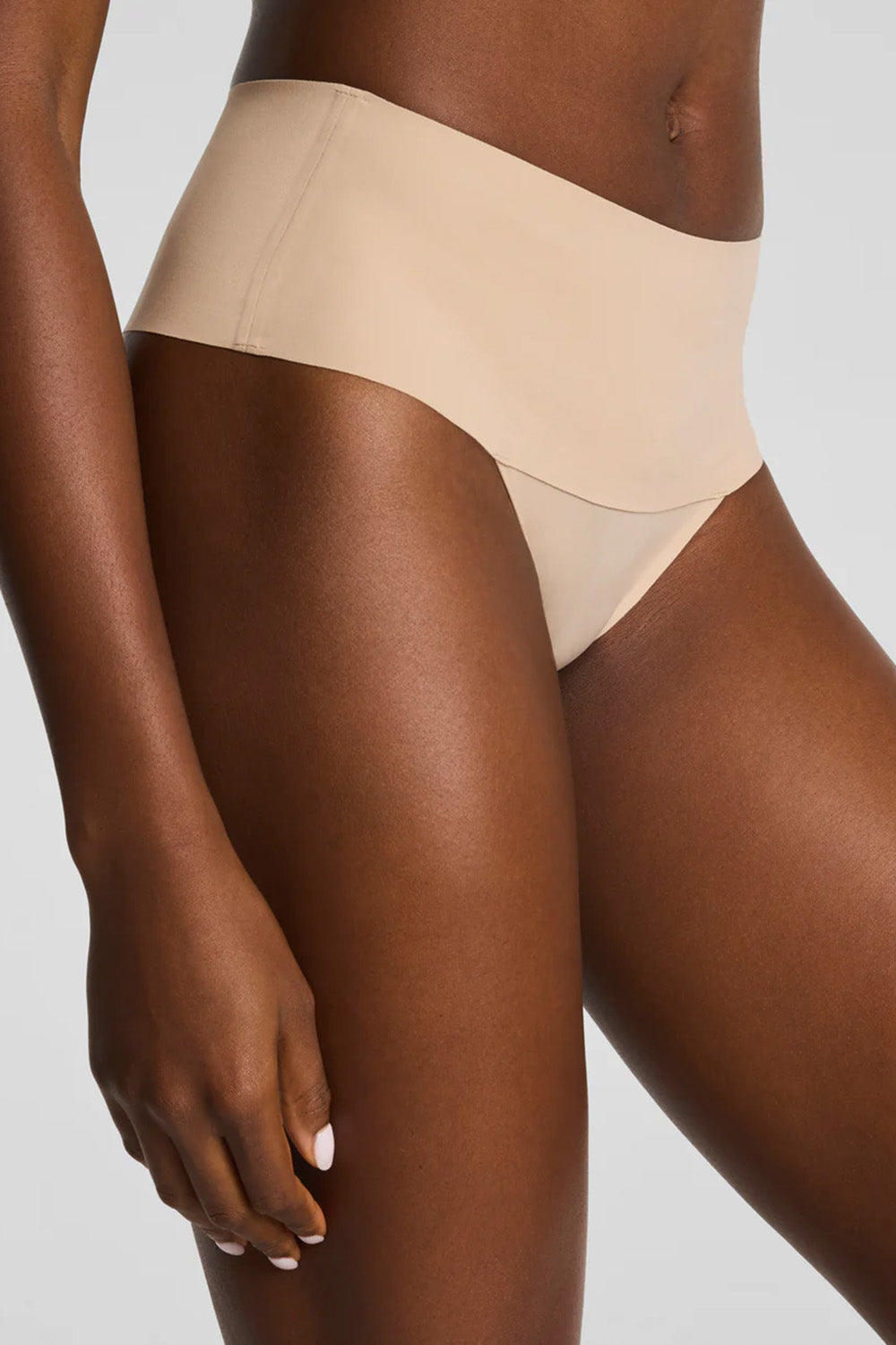 spanx undie-tecable thong in chai front view