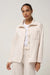 Travis Mathew Cloud Fleece Button Down in Heather Brazillian Sand — Quarter view