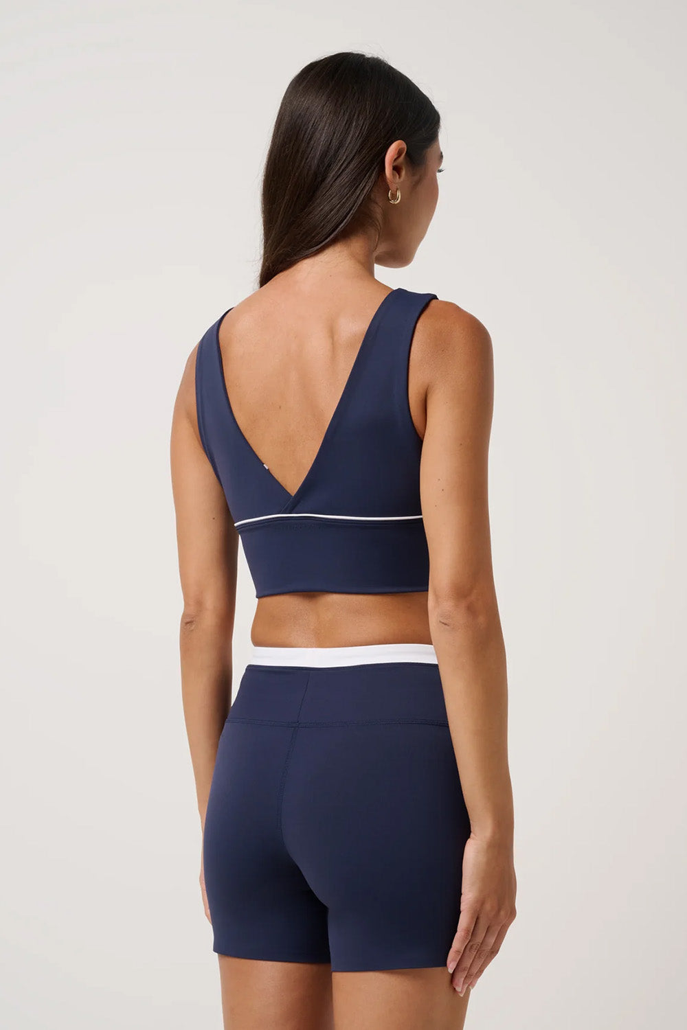 travis-mathew-moveknit-vneck-bra-top-navy-blazer-back
