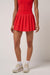 travis mathew breezeblend court skort tomato front