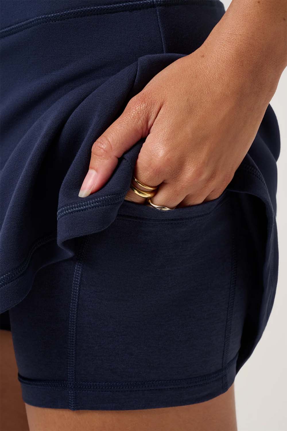 travis mathew skyloft soft aline skort navy blazer detail