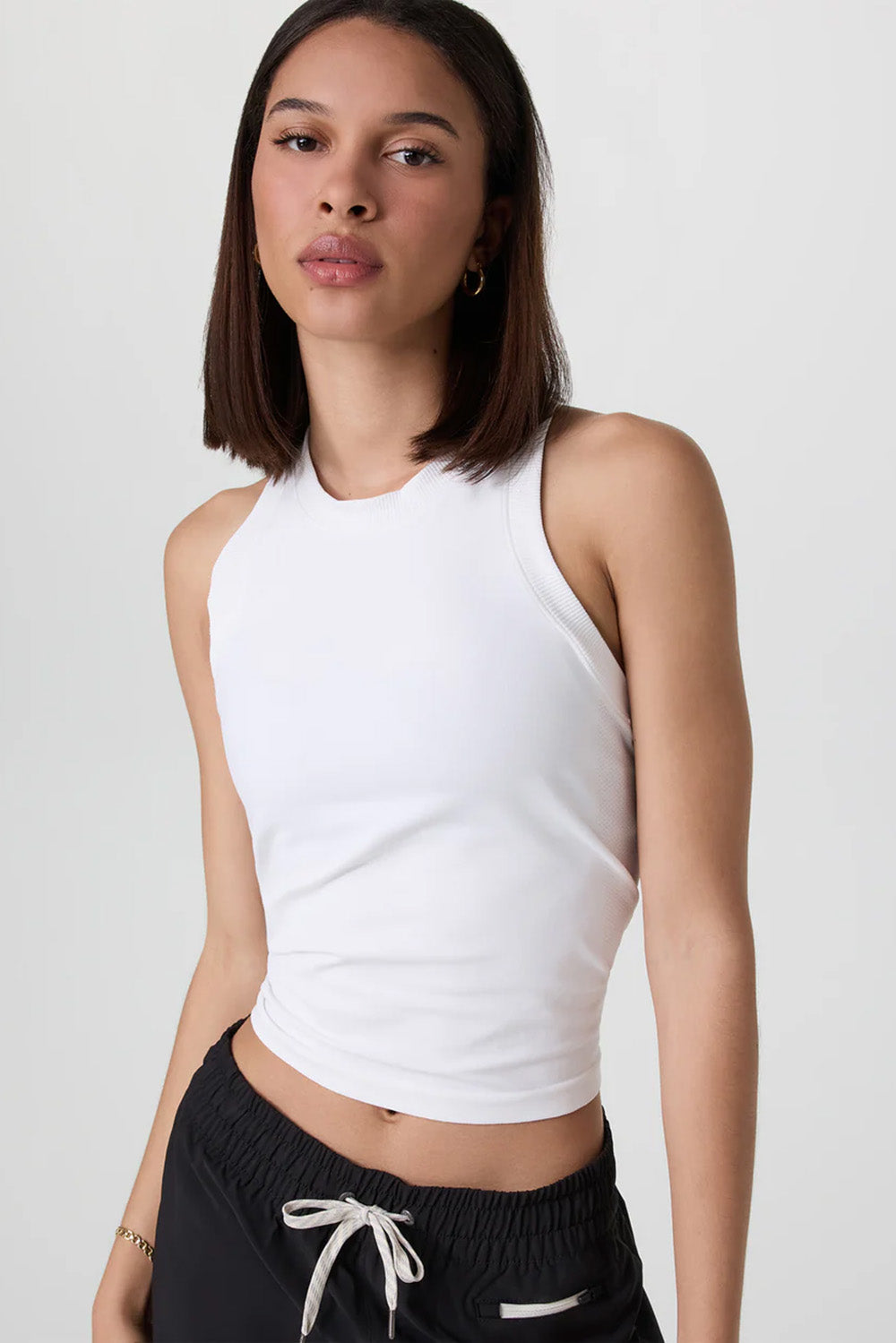 vuori-surge-seamless-tank-white-profile