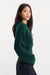 Good American The Chunky Knit Sweater in Forest Green — Side view